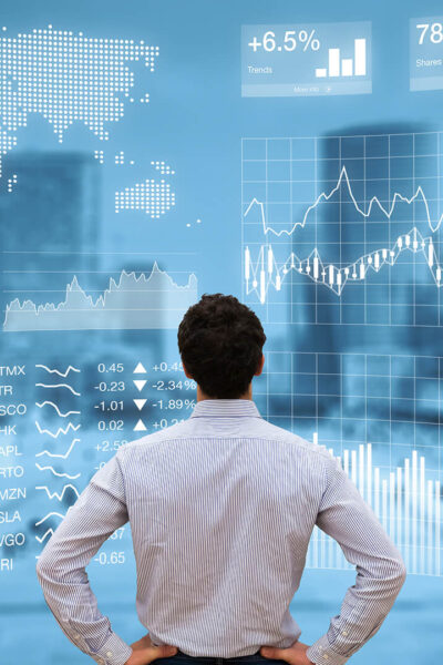 Person analyzing financial dashboard with KPI and business district background A person is analyzing a finance dashboard with KPIs and BI diagrams projected in front of a modern business quarter.