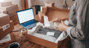 Omni channel logistics delivery: A customer unpacks a parcel