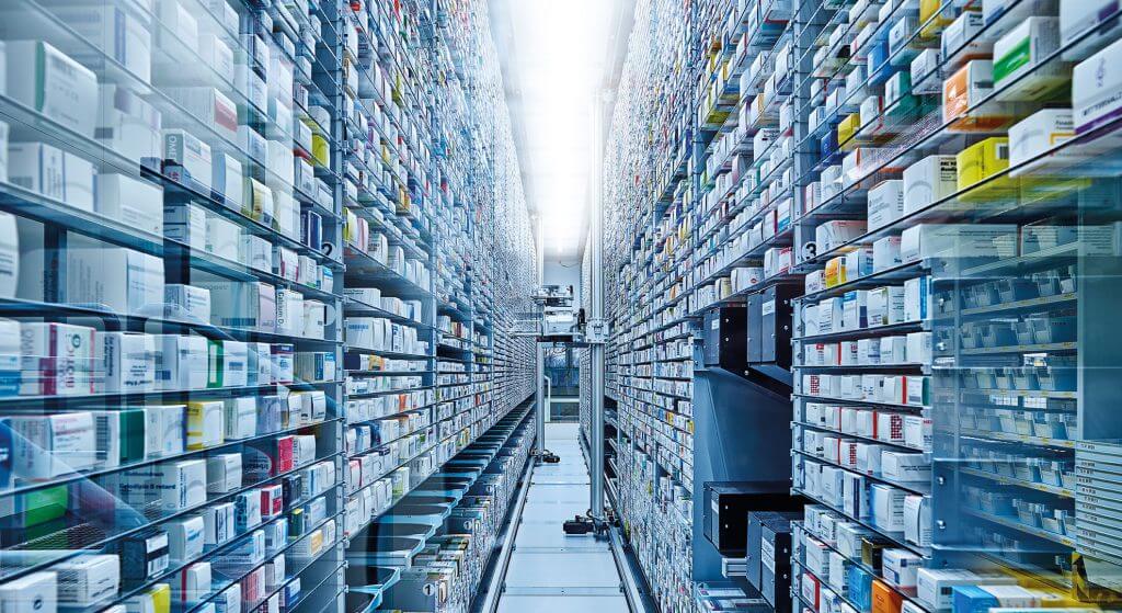 View into the aisle of a KNAPP-Store, an intelligent, innovative storage and picking system for automated single item picking. The storage robot in the KNAPP-Store is storing and retrieving medicines. The KNAPP-Store, an automated picking system, is well-suited to pharmaceutical wholesaling.