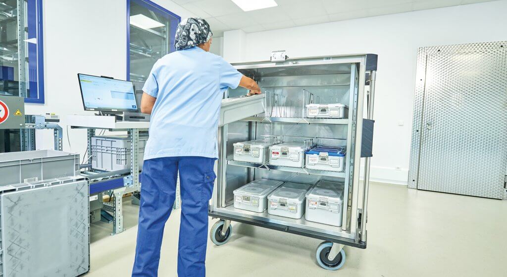 Sterilisation A man can be seen from behind looking after a sterilisation station at the KNAPP supply campus.