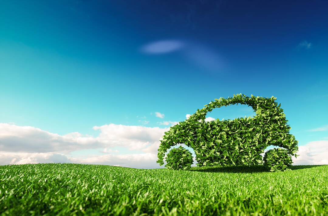 Eco friendly car development, clear ecology driving, no pollution and emmission transportation concept. 3d rendering of green car icon on fresh spring meadow with blue sky in background. renewable energy