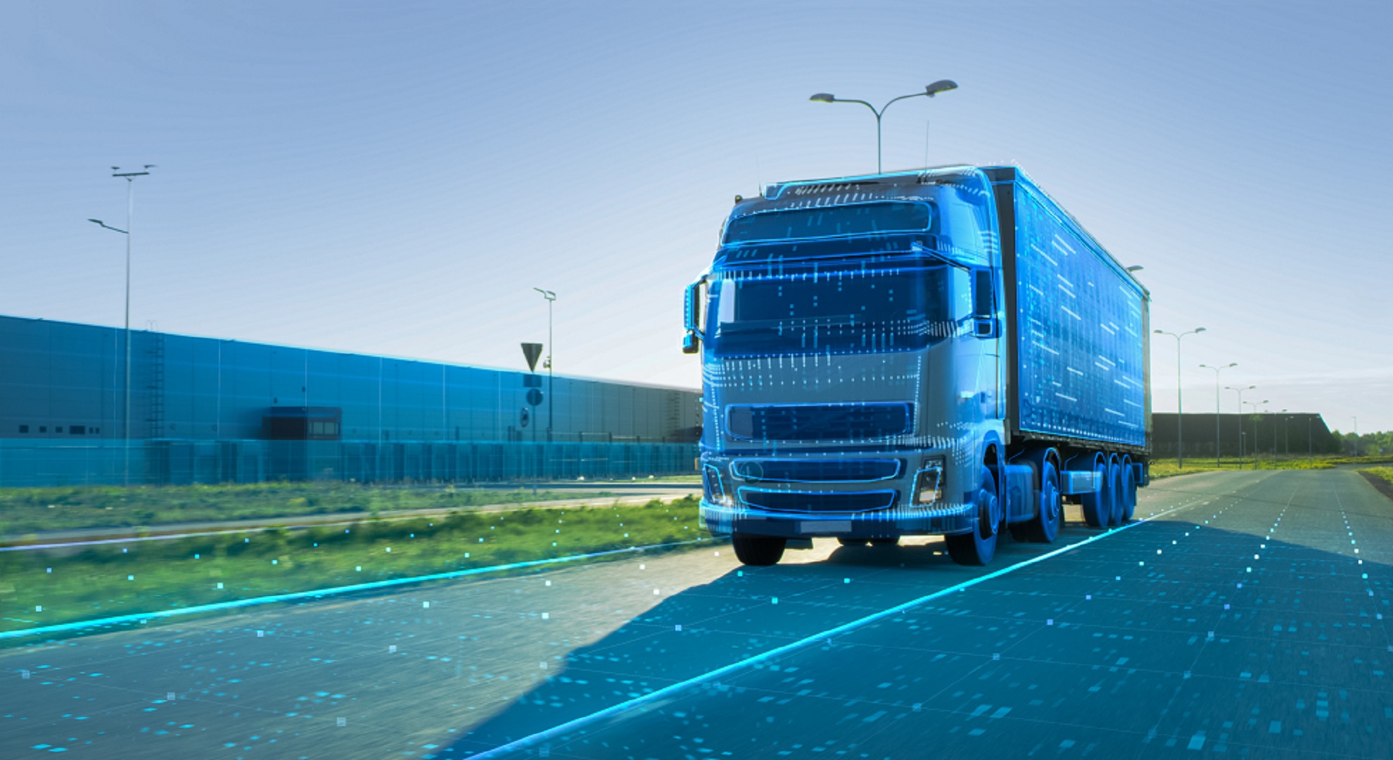 Un camion futuriste avec des petites lumières turquoises sur la route