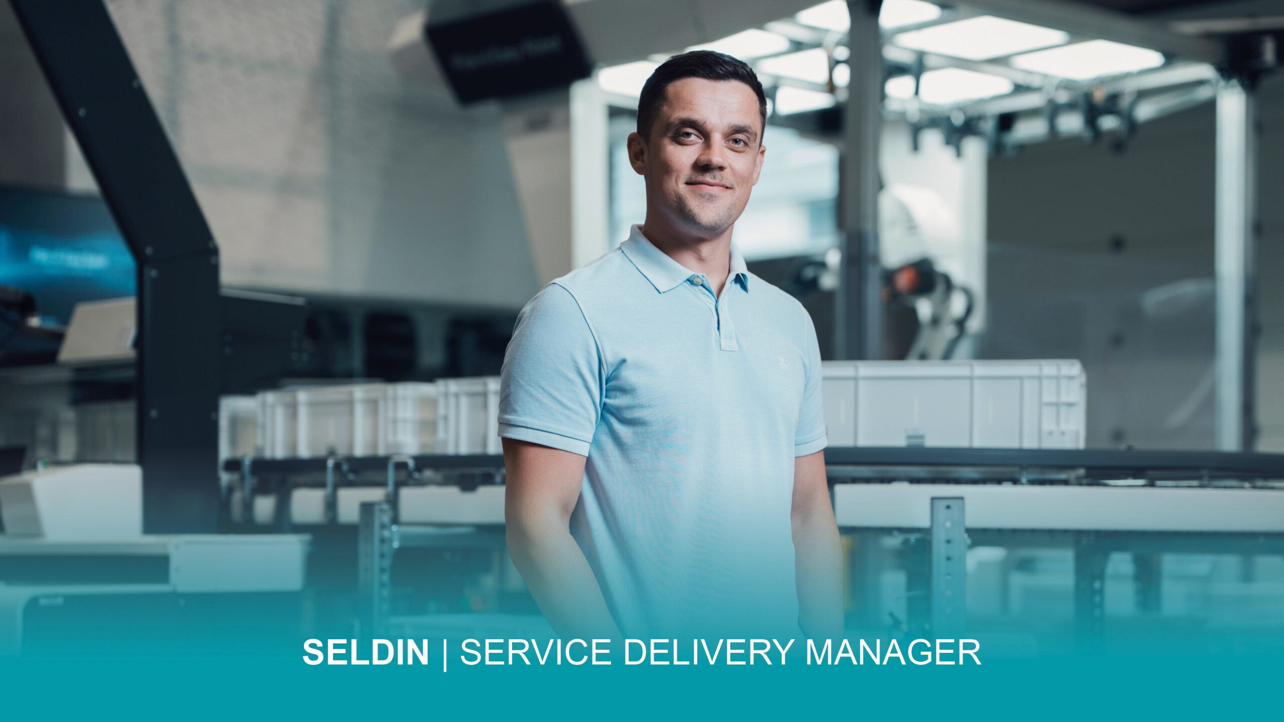 A man wearing a light blue polo shirt stands in a modern warehouse environment. The following text is integrated into the image: "SELDIN | SERVICE DELIVERY MANAGER.
