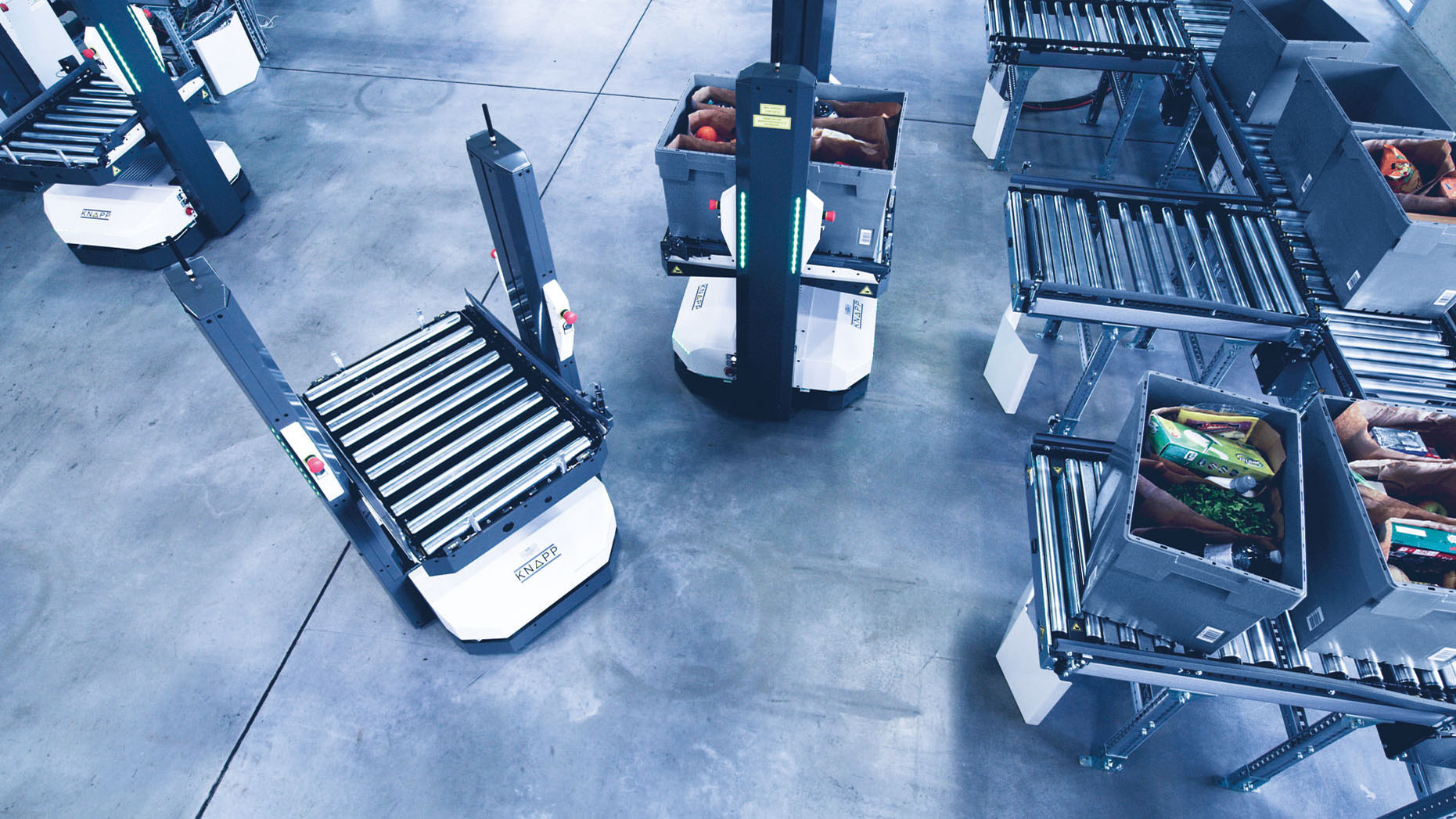 Autonomous mobile robots, the Open Shuttles, in a micro fulfillment center.