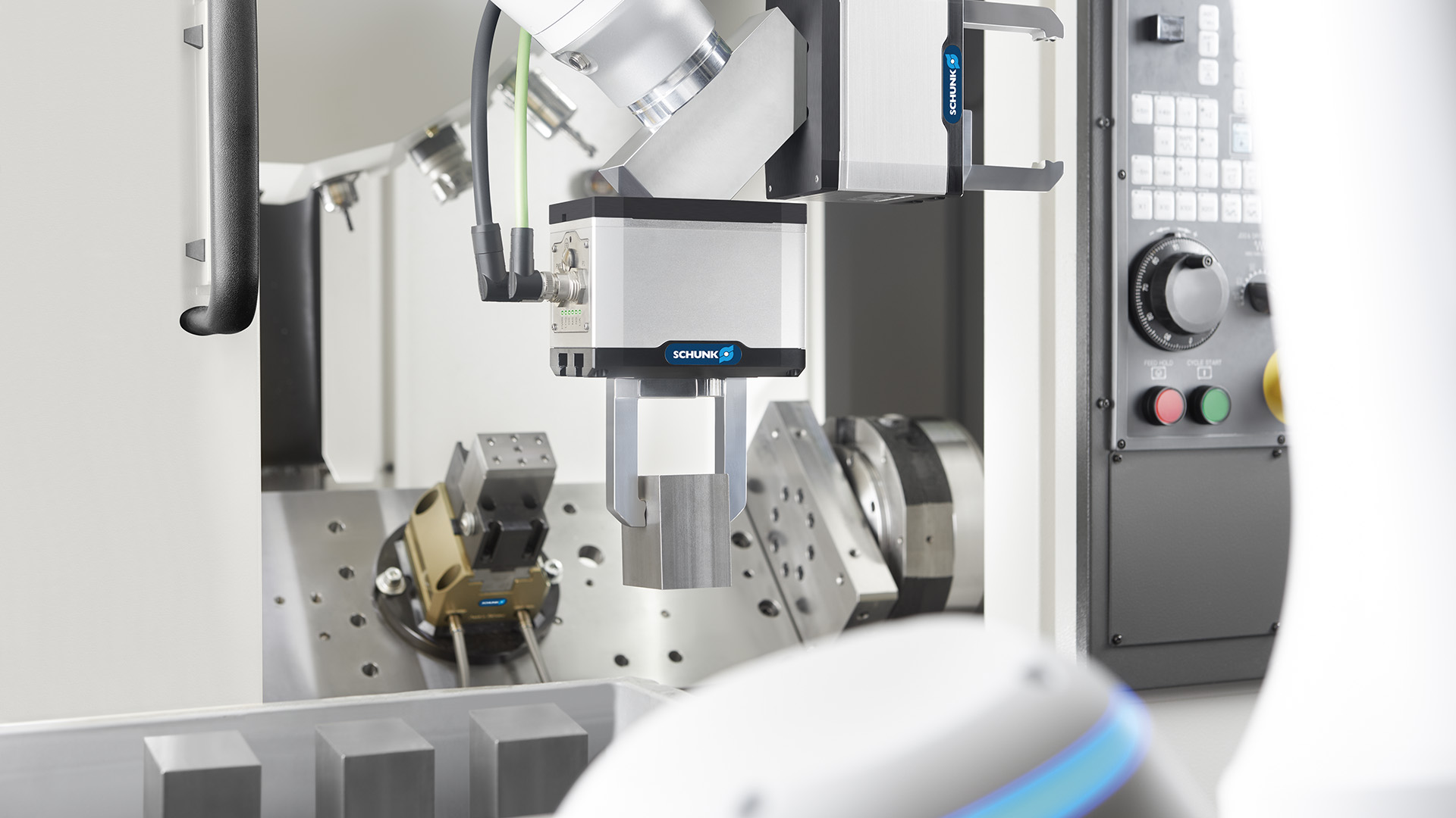 Mobile robot transports gripper components Image shows a double gripper for machine loading by Schunk.